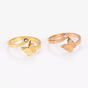 Frosted stainless steel open butterfly rings in gold and rose gold with crystal accents