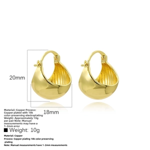 Macro detail of 18k gold plated hollow hoop earrings with minimalist texture