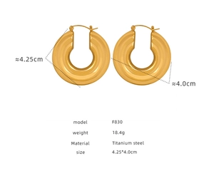 Macro detail of gold titanium steel hoop earrings showing 4.25cm size and 18.4g weight