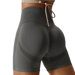 Dark grey high-waisted seamless yoga shorts with peach lift and breathable mesh panels