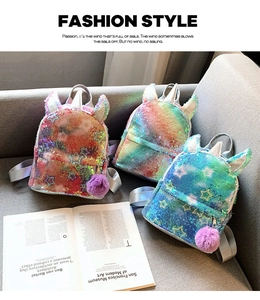 Detail showing colorful sequin unicorn backpacks with fuzzy pom pom and star patterns
