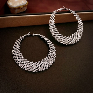 Silver multi-layer woven hoop earrings with sparkling rhinestones in a luxury style