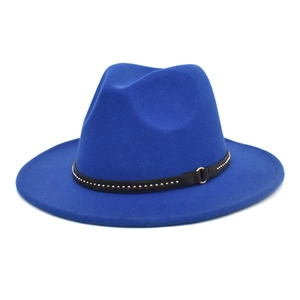 Close-up of royal blue fedora hat featuring a black leather band with metallic studs