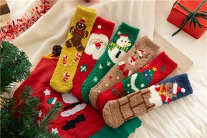 Close-up of fluffy Christmas socks featuring colorful holiday patterns and festive decor