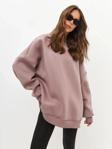Close-up of Morandi pink-purple oversize sweatshirt showing ribbed cuffs and drop shoulder