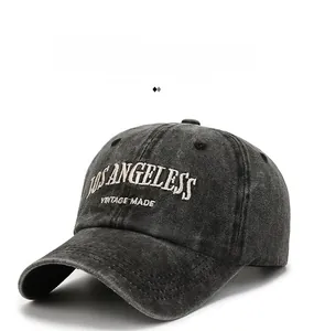 Detailed view of Los Angeles vintage embroidery on a washed black cotton baseball cap