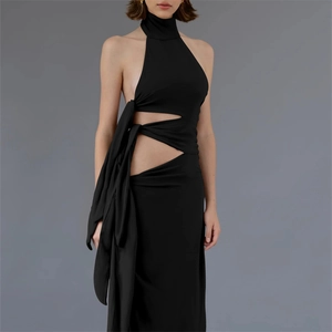 Close-up of black halter neck maxi dress featuring cutout details and lace-up back design