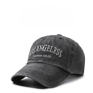 Detail of vintage washed dark gray cotton baseball cap with Los Angeles embroidery