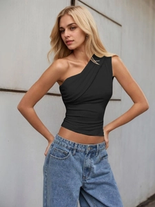 Detailed view of the side pleats and ruched texture on this black one-shoulder top