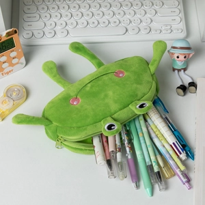 Detail shot of a green plush frog pencil case featuring a large capacity storage design