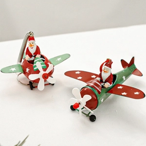 Retro metal airplane Christmas ornaments featuring Santa Claus and reindeer figurines