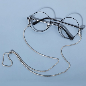 Detail of silver snake chain eyewear strap with lobster clasp and silicone loop connectors