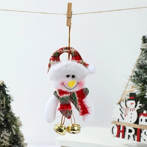 Close-up of plush snowman ornament with red checkered hat and golden bells for Christmas