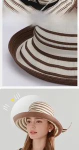 Detail view of woven straw sun hat with 6cm brim and striped UV protection pattern