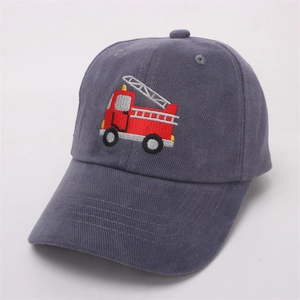 Close-up of red fire truck embroidery on a grey cotton kids baseball cap with fine stitching