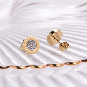 Golden stainless steel stud earrings with Roman numerals and shimmering crystals