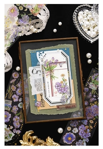 Macro detail of vintage purple floral stickers with butterflies in a decorative frame