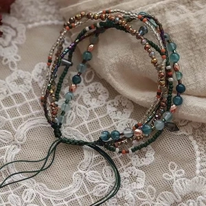 Bohemian multi-layer crystal bead bracelet with turquoise and bronze accents on lace