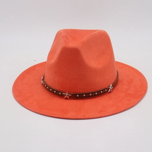 Close-up of bright orange cowboy hat with brown leather band and silver star studs