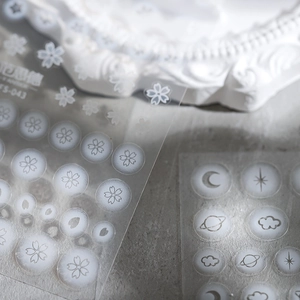 Matte ultra-thin nail art stickers featuring white cherry blossoms and starry sky patterns