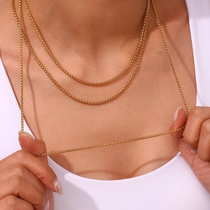 Close-up of 18K gold plated stainless steel box chain necklace with elegant texture