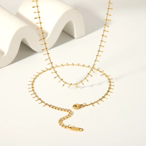 Detail of 18K gold plated stainless steel tassel necklace with lobster clasp and chain