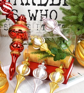 Close-up of red and white Christmas finial ornaments with glitter texture details