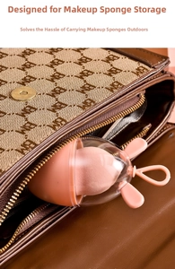 Portable pink capsule case with beauty blender being placed into a brown patterned bag
