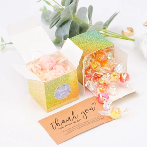 Detailed holographic cube gift box featuring thank you cards and colorful internal filler