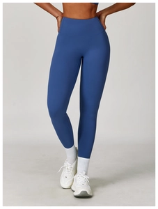 Detail of high-waisted seamless navy yoga leggings with wide compression waistband