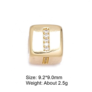 Macro shot of 9.2mm gold cube bead with cubic zirconia inlay and product dimensions