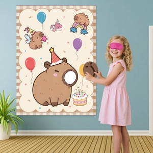 Kid playing pin the nose on capybara game at a birthday party with wall poster
