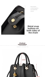 Vue détaillée du sac à main noir en cuir grainé avec ferrures dorées et pompon décoratif