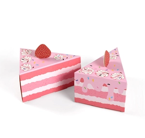 Detailed view of pink and white triangle paper gift boxes in a cake slice design with strawberry cards