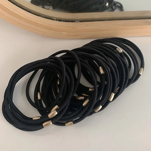 Durable high-elastic black hair ties with gold metal bead accents in a 20-piece set