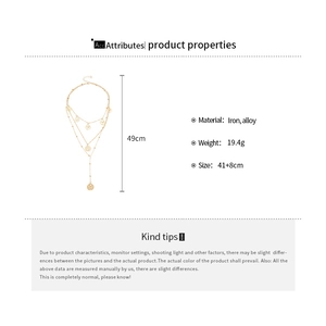Detail view of multi-layer gold coin pendant necklace showing chain lengths and dimensions