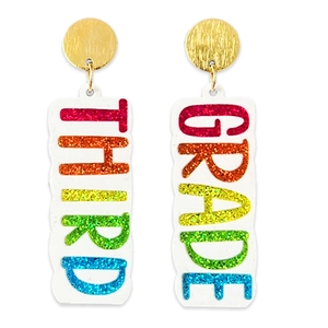 Detailed close-up of Third Grade teacher earrings with rainbow lettering and gold studs