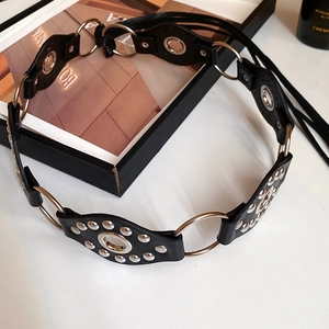Black leather punk waist chain featuring silver studs and circular metal rings