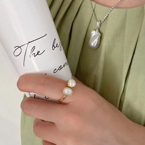 Elegant gold open ring set with freshwater pearl and shell, with matching necklace