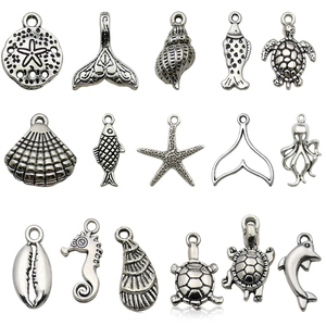 Set of 15 antique silver ocean animal charms featuring turtles, seahorses and starfish