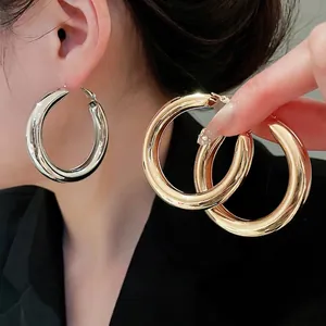 Minimalist high-polish large hoop earrings in gold and silver finish for women
