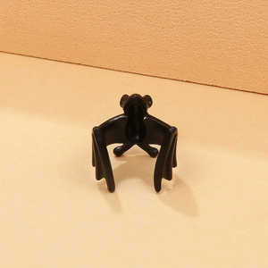 Detailed view of gothic matte black bat ring with anatomical wing texture for Halloween