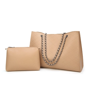Beige quilted tote bag set with chain strap and matching textured wristlet pouch