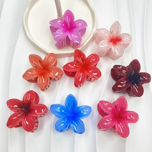 Set of eight gradient candy-colored plumeria flower hair claws in shiny resin material