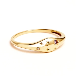Detail of S925 sterling silver ring with engraved stars and purple gemstone