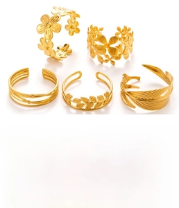 Detailed view of 5-piece gold titanium steel ring set with nature-inspired motifs