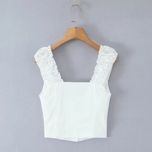 White crop top with eyelet embroidery, ruffle shoulder straps and square neckline