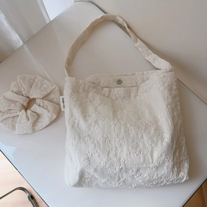 Off-white cotton canvas tote bag with floral embroidery and matching scrunchie set