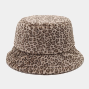 Macro detail of plush faux fur texture and leopard print on the winter bucket hat