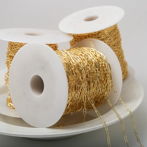 Macro view of gold plated paperclip chain rolls for DIY jewelry making material